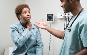 black woman with doctor at doctors office